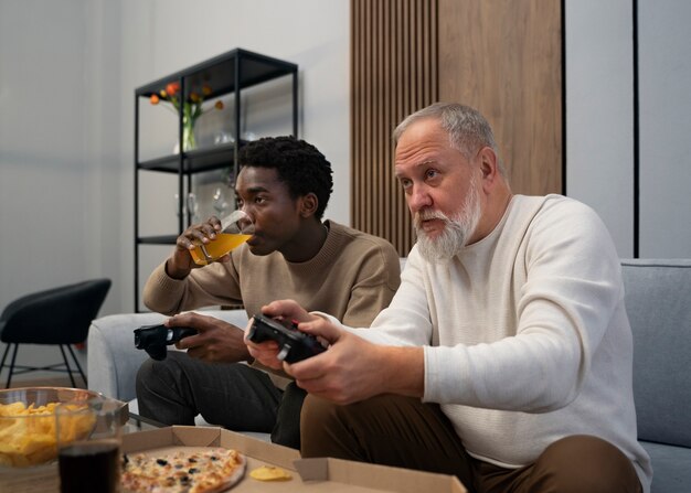 Side view men playing videogame