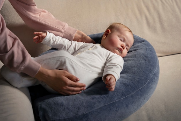 Side view mother with cute newborn