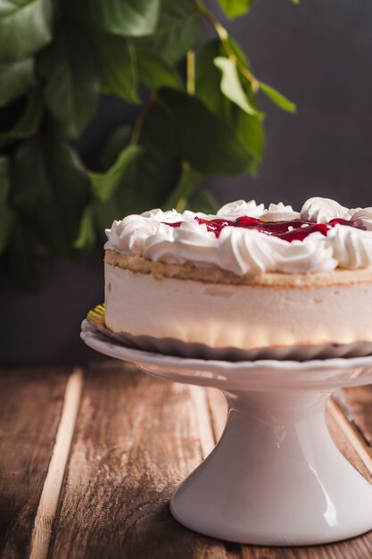 Side view mousse cake with red jam