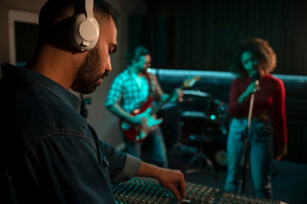 Side view musicians working in studio