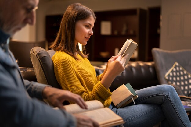 Side view  people reading together