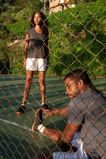 Side view people on soccer field