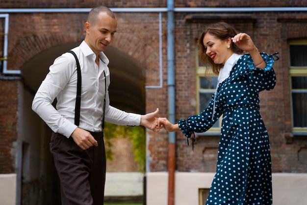 Free Photo side view people swing dancing outdoors