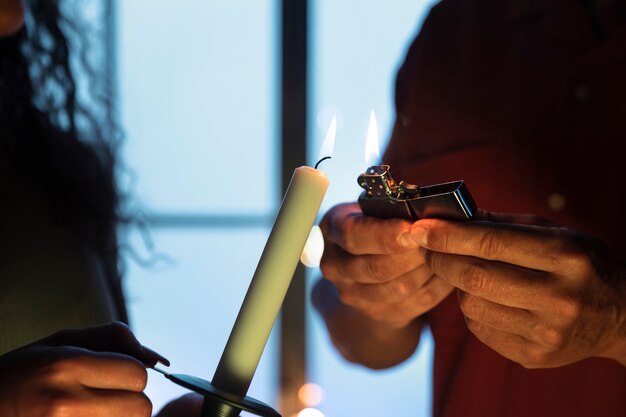 Side view people with candle and lighter