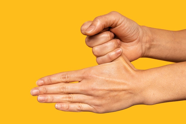 Free Photo side view person washing hands isolated on orange