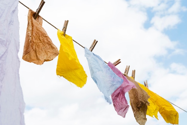 Side view pigmented cloths held by pegs composition