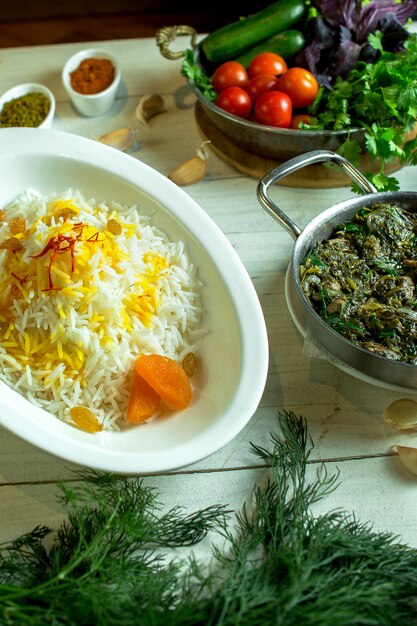 Side view of pilaf with dried fruits in plate