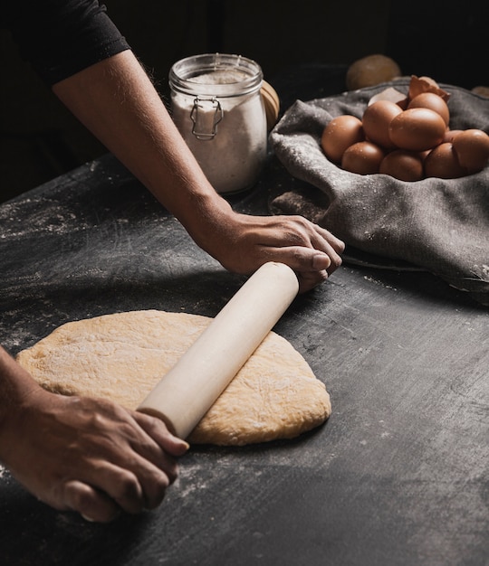 Free photo side view rolling dough composition