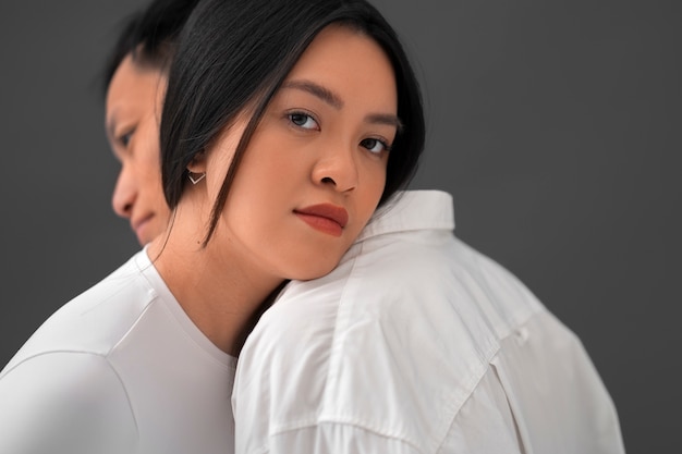 Free Photo side view romantic couple posing in studio