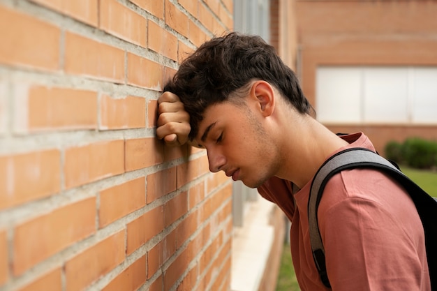 Side view sad boy at school