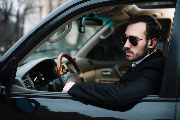 Side view security man in car