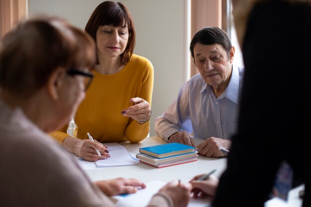 Side view senior people learning together