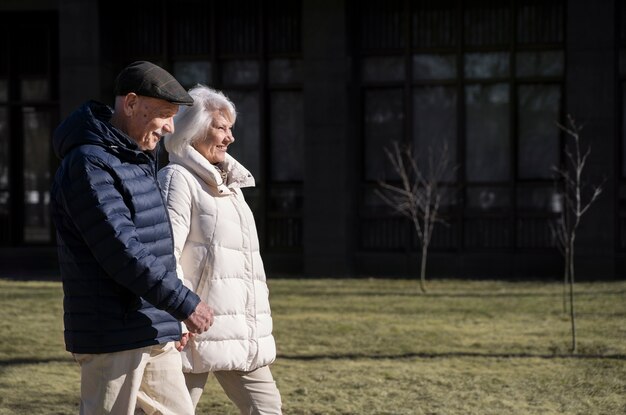 Side view senior people walking together