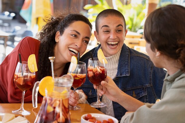 Side view smiley friends spending time together