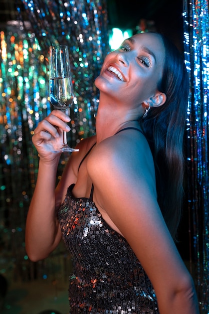 Side view smiley girl holding drink