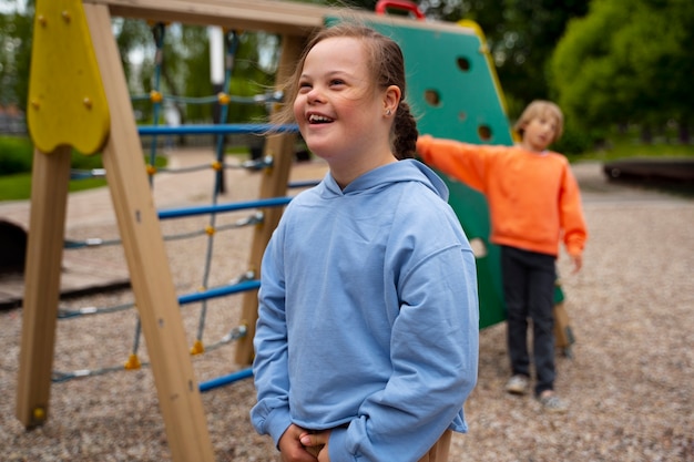 Side view smiley girl with down syndrome