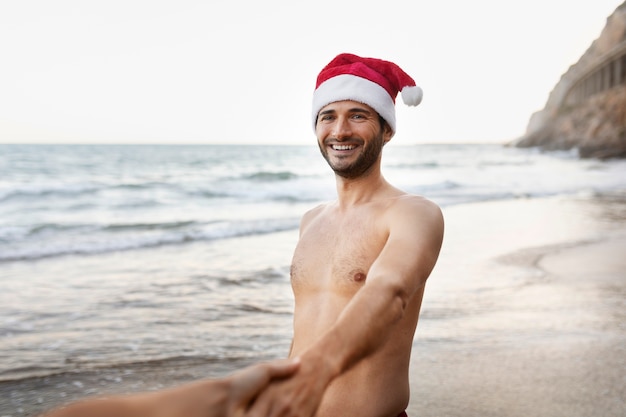 Side view smiley man with santa hat