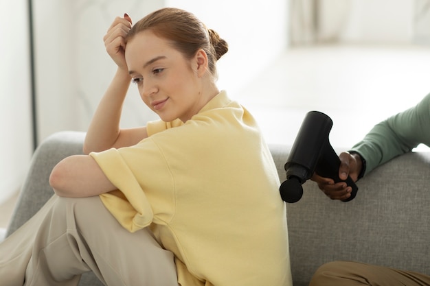 Free Photo side view smiley woman getting massage