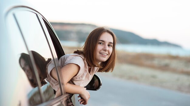 Side view smiley woman posing