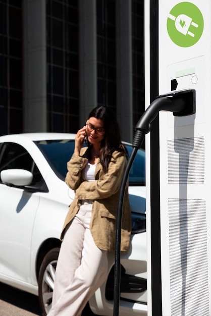 Side view smiley woman talking on phone