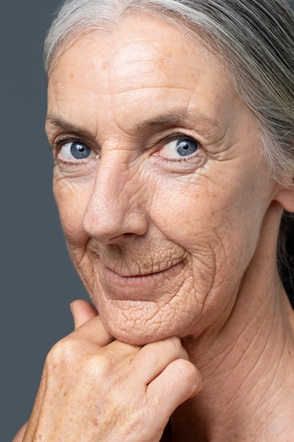 Free Photo side view smiley woman with blue eyes