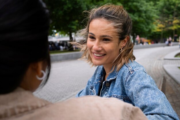 Side view smiley women outdoors