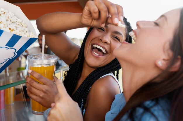 Side view smiley women with drinks