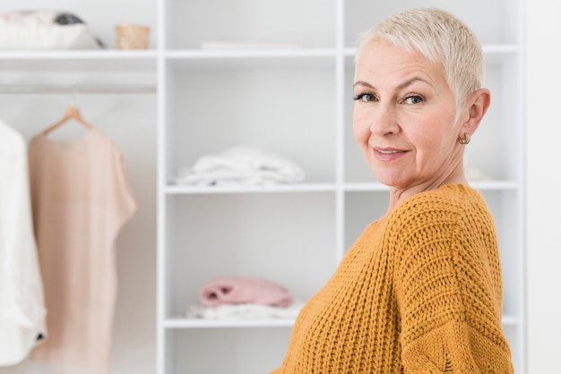 Side view of smiling elderly woman with copy space