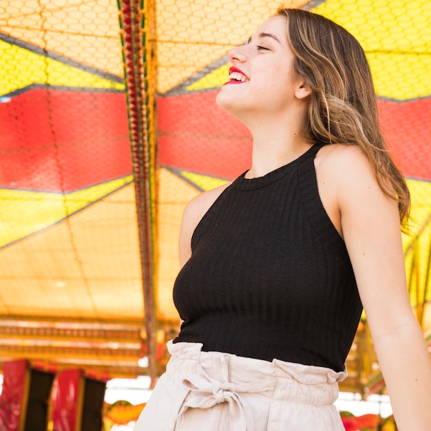 Side view of smiling young woman