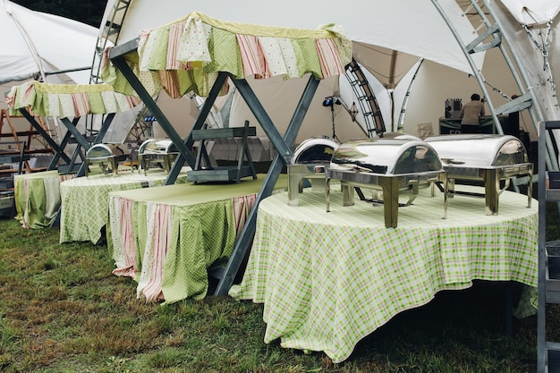 Free photo side view of tables served in garden for party