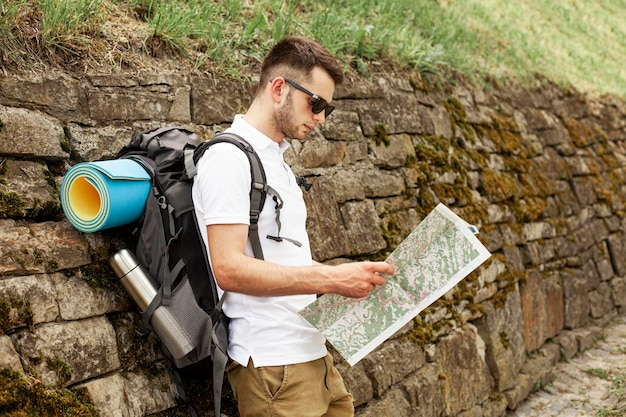 Free Photo side view traveler reading map