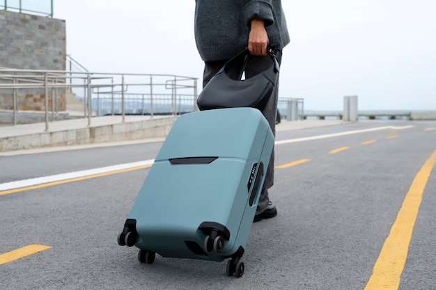 Free Photo side view traveler with suitcase