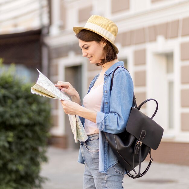 Side view traveller checking local map