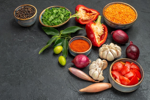 Side view vegetables bowl of lentil herbs colorful vegetables and spices citrus fruits