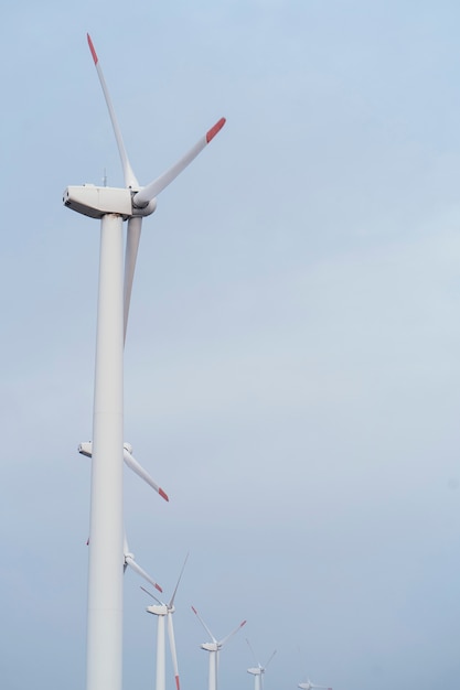 Free Photo side view of wind turbines generating energy