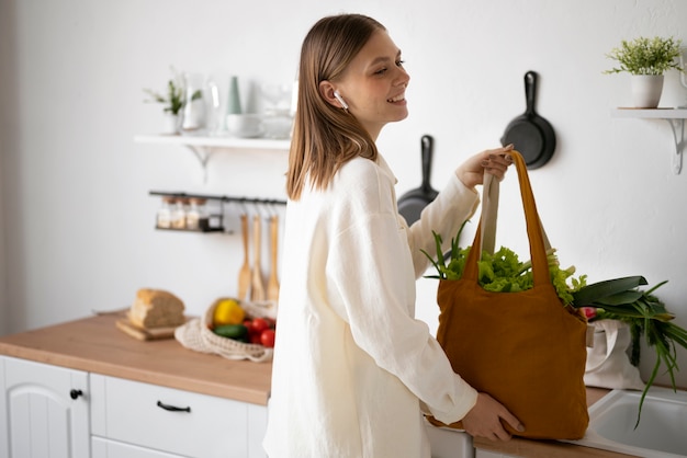 Free Photo side view woman carrying bag