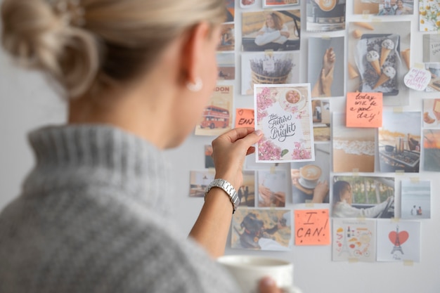 Free photo side view woman creating vision board