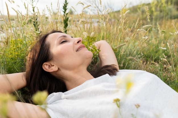 Side view of woman in grass outdoors