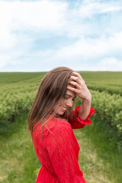 Side view woman in green field