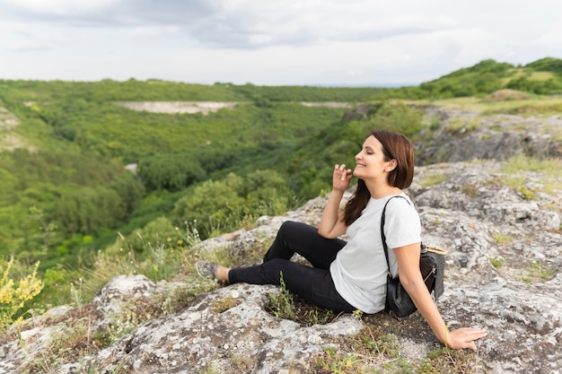 Free Photo side view of woman hiking in nature