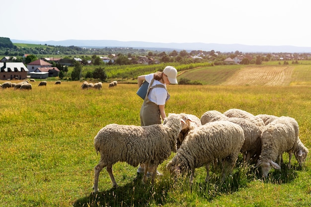 Side view woman holding bucket