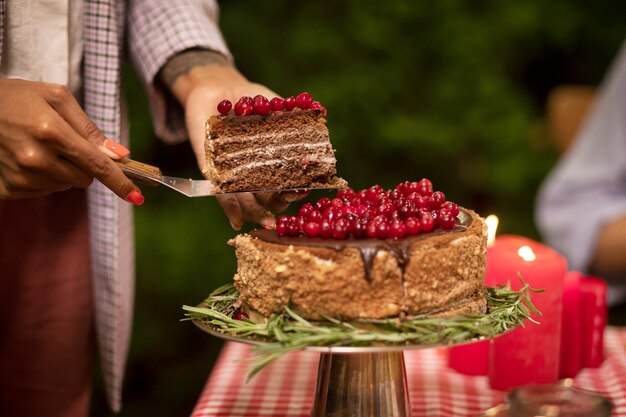 Side view woman holding cake slice