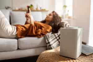 Free photo side view woman laying in bed