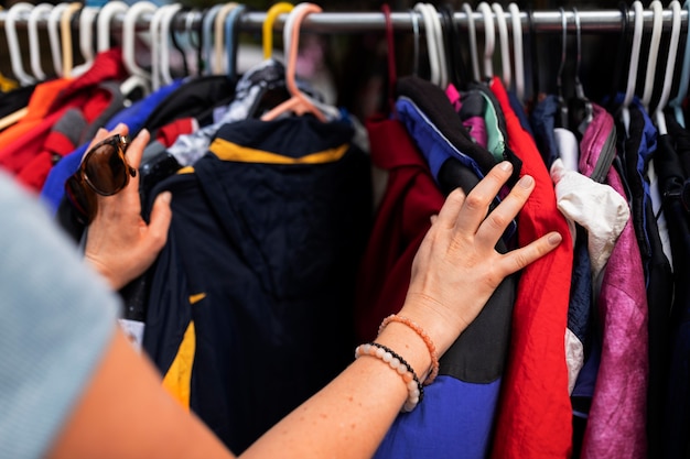 Side view woman looking at clothes