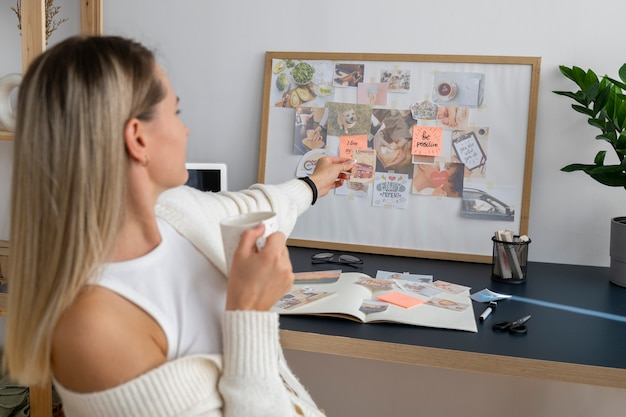 Free Photo side view woman making vision board