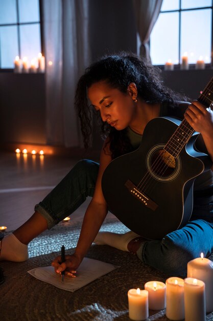 Side view woman playing the guitar