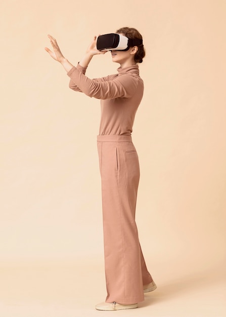 Free Photo side view woman playing on virtual reality headset