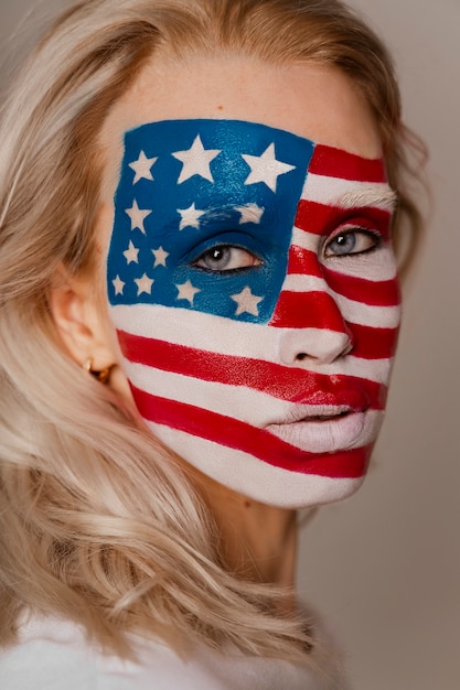 Free Photo side view woman posing with usa makeup