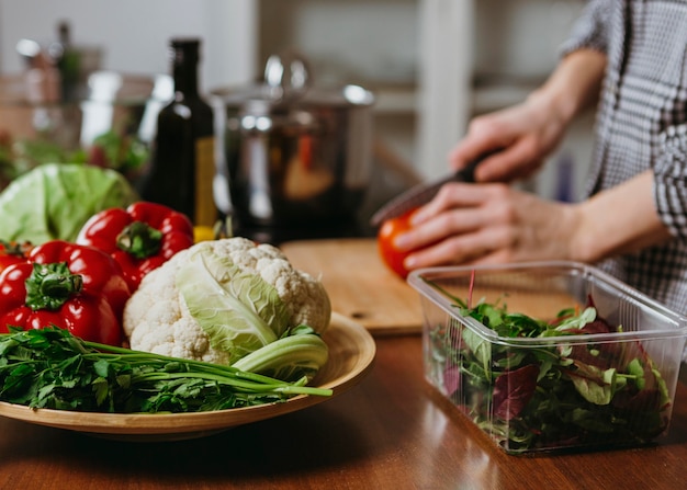 Side view of woman preparing food in the kitchen