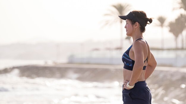 Side view woman resting after running